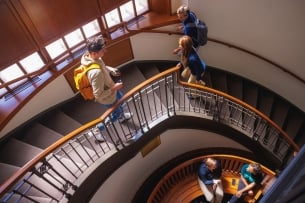 Students traversing a staircase on the DePaul University campus.