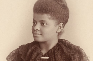 A sepia-toned portrait of Ida B. Wells, a Black woman with her hair styled on top of her head.